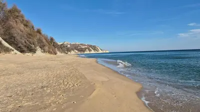 a sandy beach with the ocean on a clear day at Amazing panorama sea view apartment in Byala