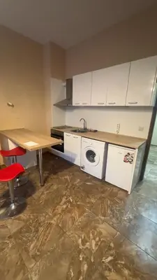 a kitchen with a sink and a washing machine at Studio paradise in Varna City