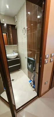 a bathroom with a shower and a sink at Rada's Apartment BSV in Burgas City