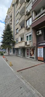 an empty street in front of a building at Rada's Apartment BSV in Burgas City