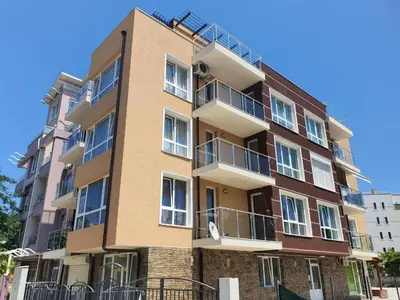a tall building with balconies on the side of it at Star Beach - Звезден плаж in Primorsko