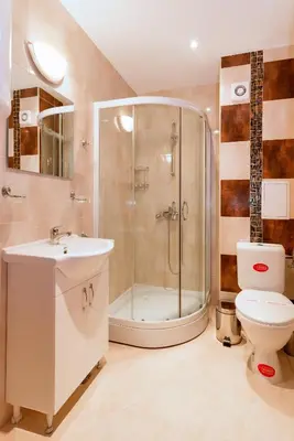 a bathroom with a shower and a toilet and a sink at Oxygen Apartments in Sveti Vlas