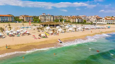 a beach with a bunch of people on the beach at Hotel Oasis Del Mare in Lozenets