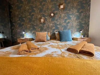 a bedroom with a bed with towels on it at Luxury Sea nest next Marina Dinevi in Sveti Vlas