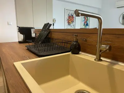 a kitchen sink with a faucet on a counter at Luxury Sea nest next Marina Dinevi in Sveti Vlas