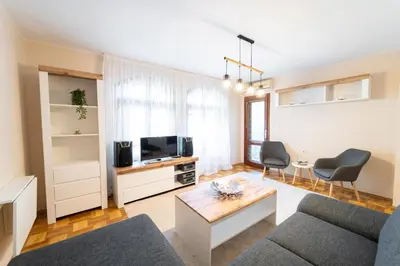 a living room with a couch and a table at Soleado in Burgas City