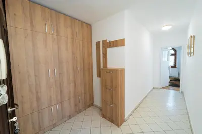 a room with wooden cabinets and a hallway at Soleado in Burgas City
