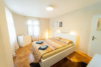 a bedroom with a bed in a room at Soleado in Burgas City