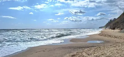 a beach with the ocean and a cloudy sky at Студио Бяла in Byala