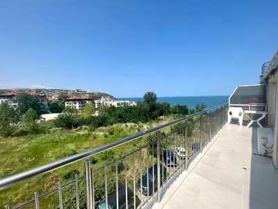 a balcony with a view of the ocean at Апартамент Съни Хаус - Sunny House Apartment in Byala