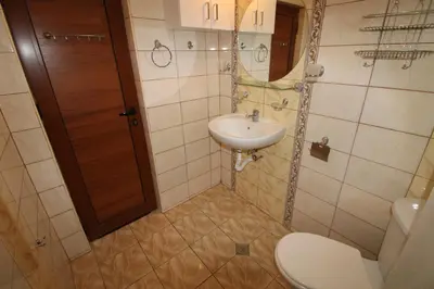 a small bathroom with a sink and a toilet at Amadeus 5 - Menada Apartments in Sunny Beach