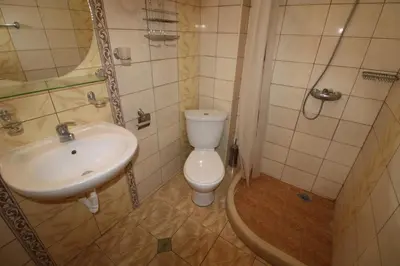 a bathroom with a toilet and a sink at Amadeus 5 - Menada Apartments in Sunny Beach