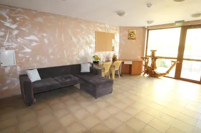 a living room with a couch and a table at Amadeus 5 - Menada Apartments in Sunny Beach