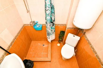 an overhead view of a bathroom with a toilet and a shower at Roman Thermae, steps from the sea with free parking in Varna City