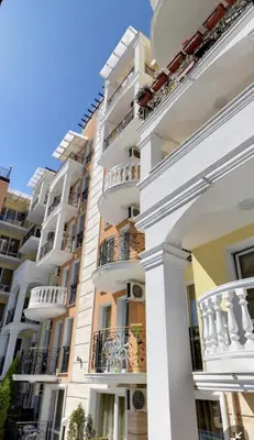 a large white building with balconies on the side at Excellent apartment on the 6th floor in Sunny Beach