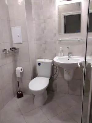 a bathroom with a toilet and a sink at Path ways to the Sea -Пътека към морето in Primorsko