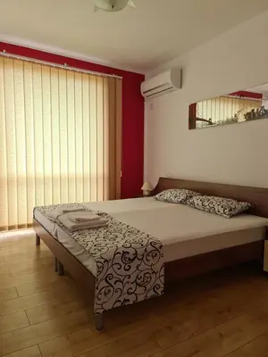 a bedroom with a bed in a room at Guest House Nedelchevi in Primorsko