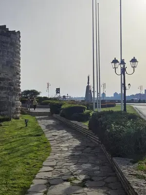 a stone walkway with a statue in the distance at Elite 4 in Sunny Beach