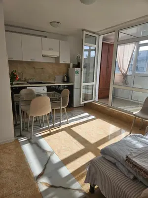 a kitchen and dining room with a table and chairs at Elite 4 in Sunny Beach