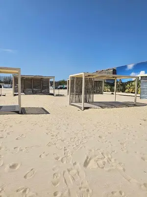 a volleyball court on a beach with footprints in the sand at Elite 4 in Sunny Beach