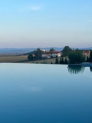 a view of a lake with a house in the background at Family Apartment with Sea View Vineyard Spa Resort Aheloy in Aheloy