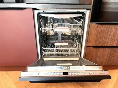 a dishwasher with its door open with food inside at Miramar Front Beach Family Deluxe Studios No Swim Pool Access in Sunny Beach