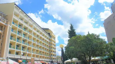 a large building with a blue sky in the background at Miramar Front Beach Family Deluxe Studios No Swim Pool Access in Sunny Beach