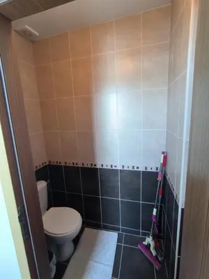 a bathroom with a toilet and a tiled wall at complex Sol Marine sunny beach in Sunny Beach