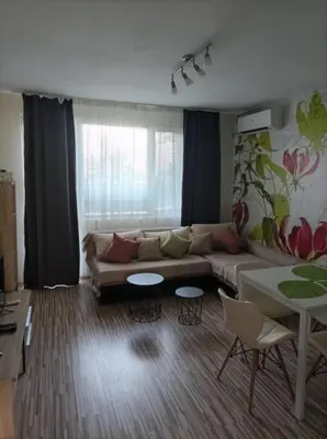 a living room with a couch and a table at Apartment Maria Luisa in Burgas City