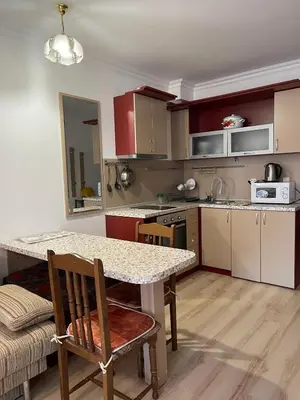 a kitchen with a table and a counter top at Amphora studio 209 in Sveti Vlas