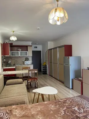 a living room with a kitchen and a dining room at Amphora studio 209 in Sveti Vlas