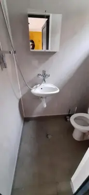 a bathroom with a sink and a toilet at Бунгало Шангри Ла - 1, плаж Градина in Sozopol
