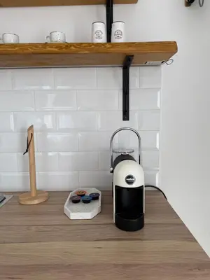 a toaster sitting on top of a kitchen counter at Flores Garden Pool Side and Sea View Apartment in Chernomorets