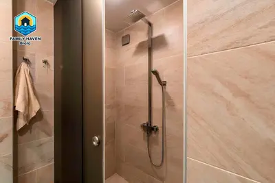 a shower with a glass door in a bathroom at Вилла Biala family haven in Byala