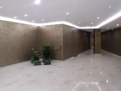 an empty room with plants in a building at Vigo apartment in Nesebar