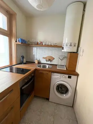 a kitchen with a washing machine and a sink at Bonne Chance Apartment Sozopol in Sozopol