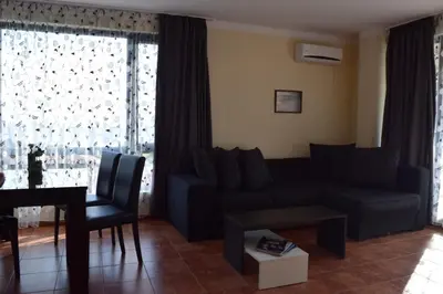 a living room with a couch and a table at Sea Club Sarafovo Apartments in Burgas City