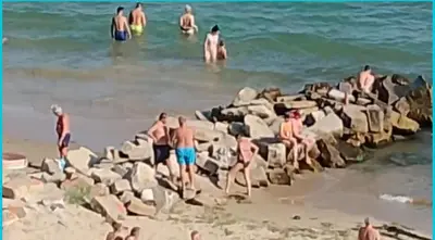 a group of people in the water at the beach at ETARA - 1 Rey&Mar Saint Vlas in Sveti Vlas