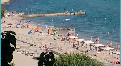 a beach with a bunch of people and the ocean at ETARA - 1 Rey&Mar Saint Vlas in Sveti Vlas