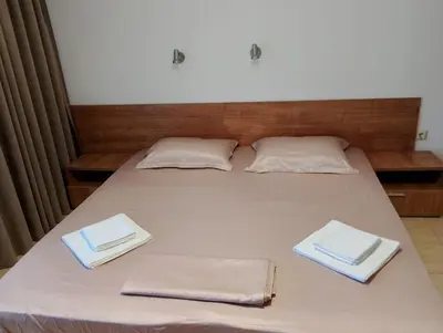 a bed with two white towels on top of it at ETARA - 1 Rey&Mar Saint Vlas in Sveti Vlas