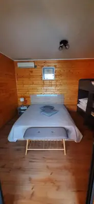a bedroom with a large bed in a room at Бунгало Шангри Ла - 2, плаж Градина in Sozopol