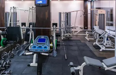 a gym with several treadmills and machines at Garden of Eden- Apartments Sweet Dreams Rey&Mar Saint Vlas in Sveti Vlas