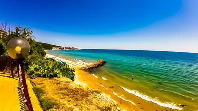 a view of a beach with the ocean at William's apartments - cute studio in Sveti Vlas