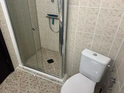 a bathroom with a shower with a toilet and a shower at Lovely Studio with Sea View Grand Hotel Sveti Vlas in Sveti Vlas