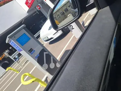 a view from a car window of a gas pump at Central park apartment Сентрал парк апартамент Бургас in Burgas City