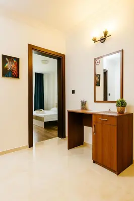 a bathroom with a vanity and a mirror at Sea Sirena with a Mountain View in Sveti Vlas
