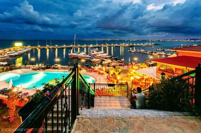 a view of a marina with a pool and boats at Sea Sirena with a Mountain View in Sveti Vlas