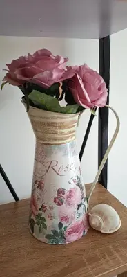 a vase filled with pink roses on a table at Cozy Studio in Hacienda by Flat Mаnager in Sozopol