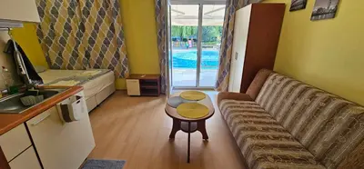 a living room with a couch and a table at Rainbow 2 studio 7 in Sunny Beach