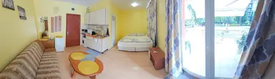a room with a kitchen with a couch and a table at Rainbow 2 studio 7 in Sunny Beach